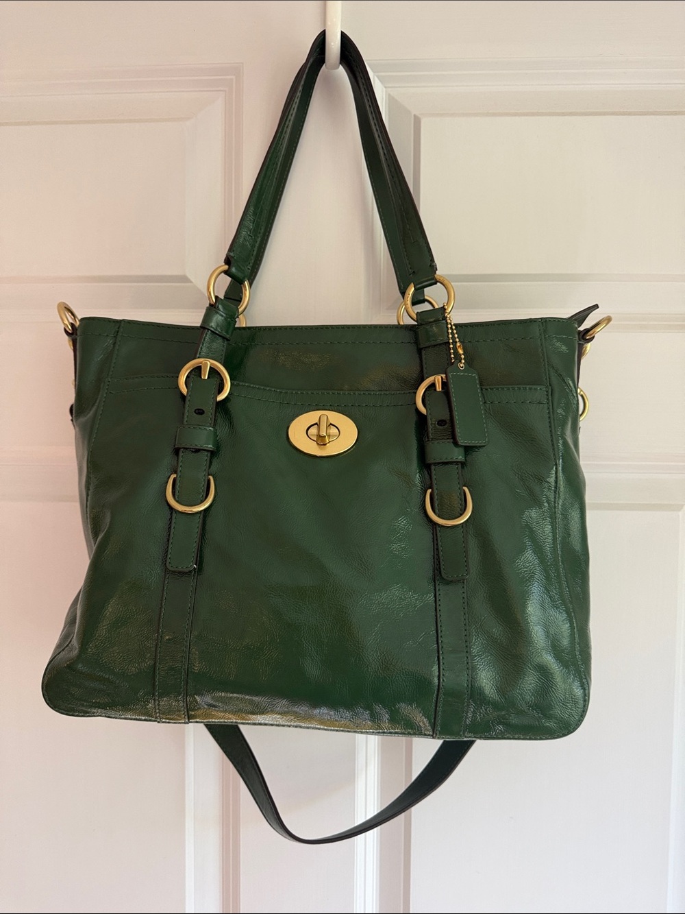 Coach Chelsea Handbag (Style F14022) in a forest green patent leather finish.